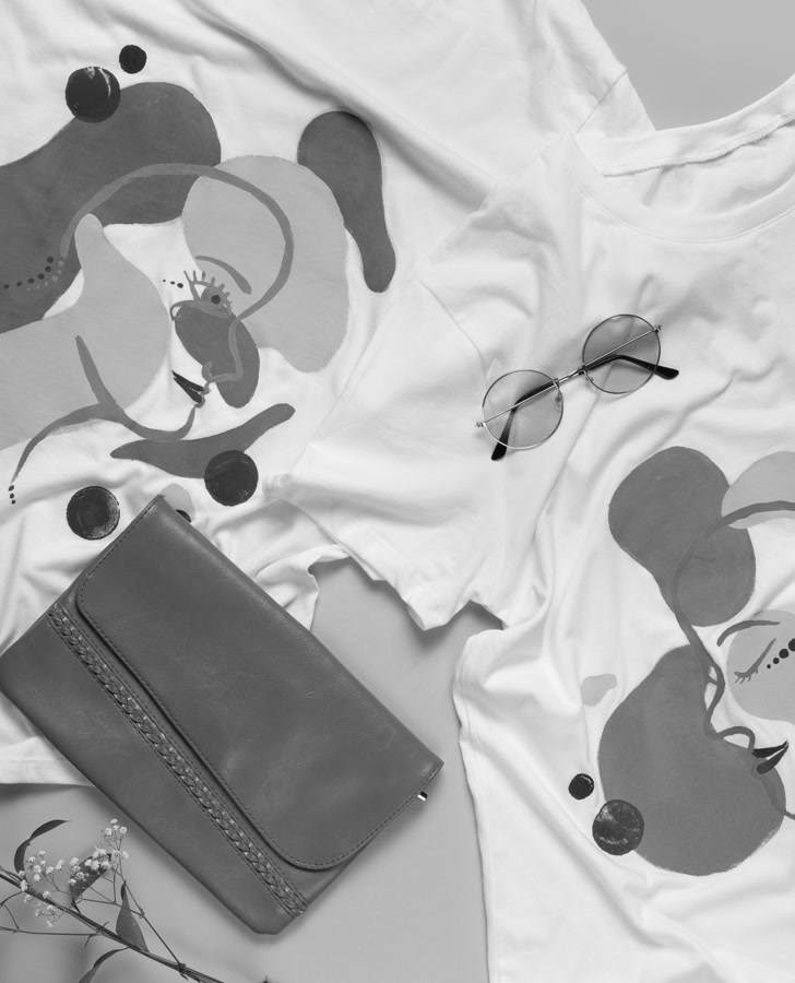 Printed T-shirts laid flat to represent garment decoration and apparel printing solutions