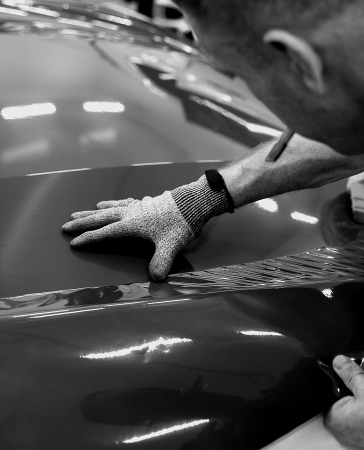 Wrapping and laminating materials for vehicle graphics and protected surface finishes